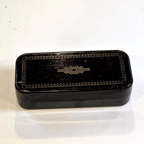 Greist Sewing Machine Accessories in a decorative painted black tin box